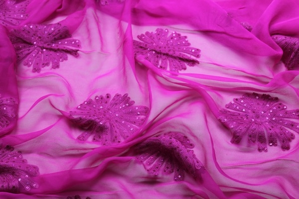 Bright pink chiffon with large embroidered flowers, and small round holographic sequins