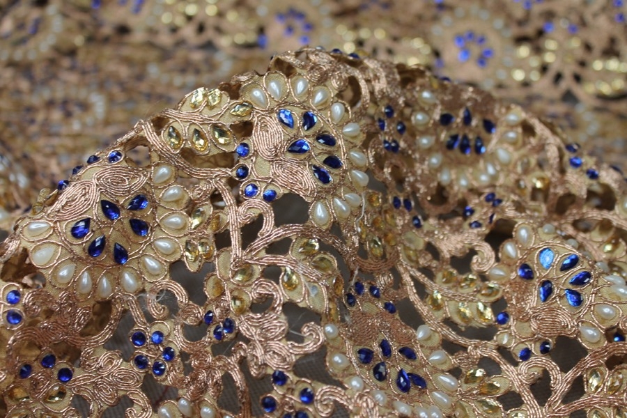 Gold Corded Cut Out Fabric with Pearls and Blue Jewels