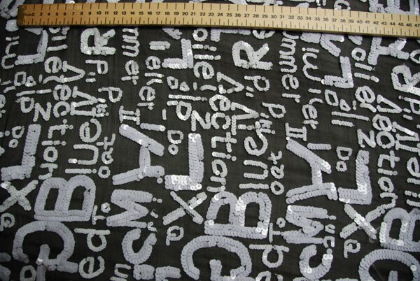 Black chiffon with white round sequin lettering