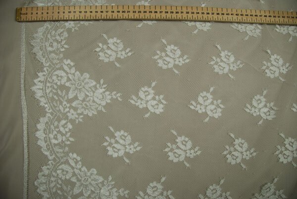 Cream Leavers lace in a graduated floral pattern with detailed scallop