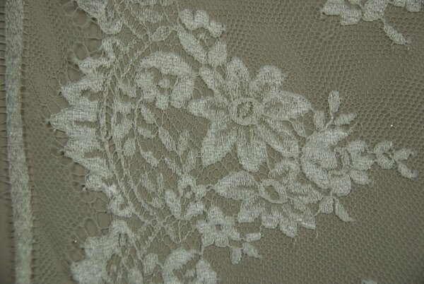 Cream Leavers lace in a graduated floral pattern with detailed scallop