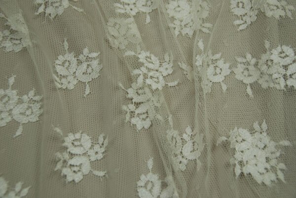 Cream Leavers lace in a graduated floral pattern with detailed scallop