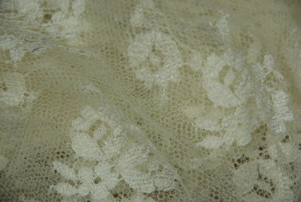 Cream Leavers lace in a graduated floral pattern with detailed scallop