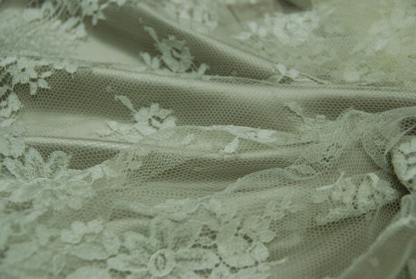 Cream Leavers lace in a graduated floral pattern with detailed scallop