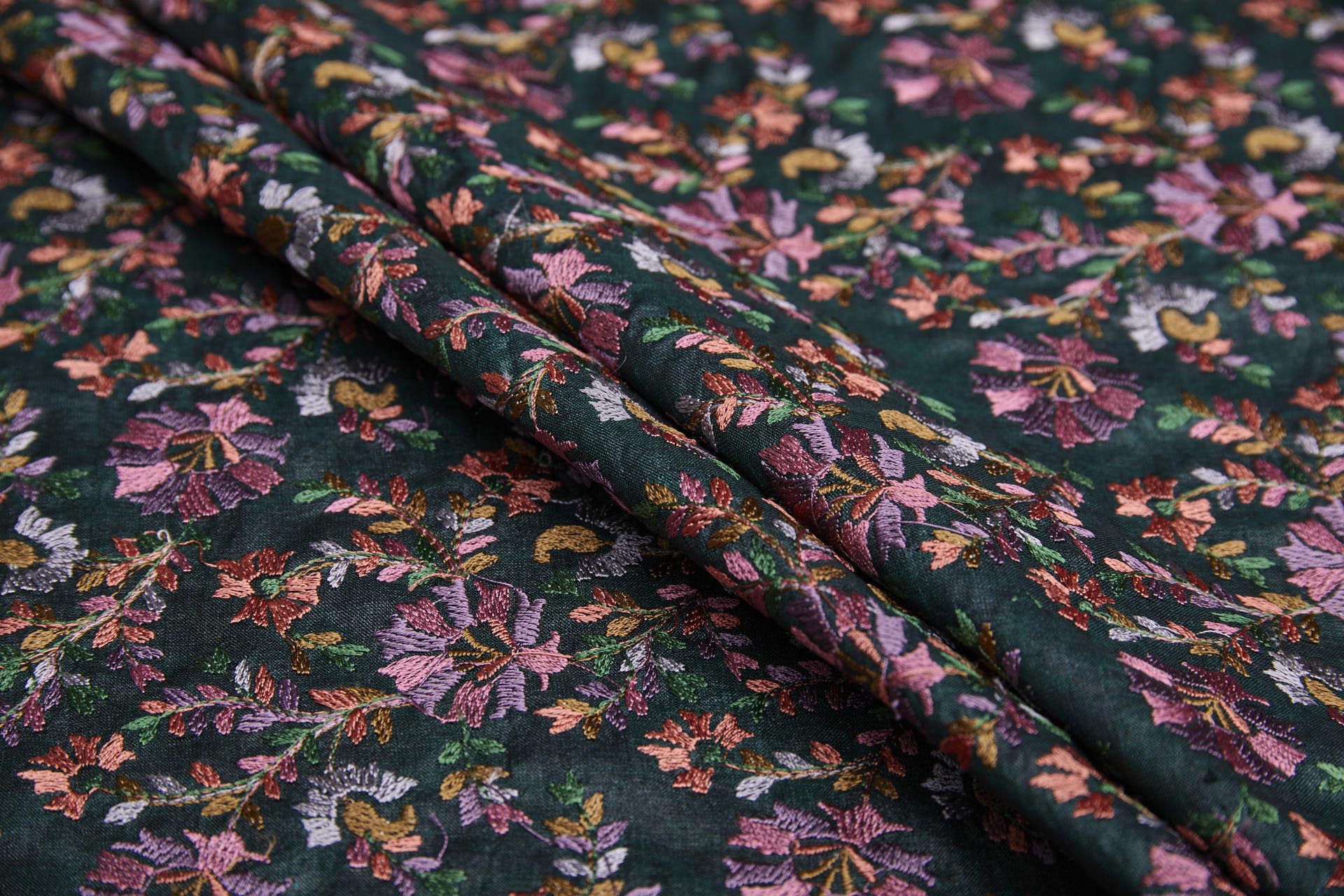 Dense Multi Coloured Floral Embroidery with Green Leaves on Dark Green Silk Tassar fabric