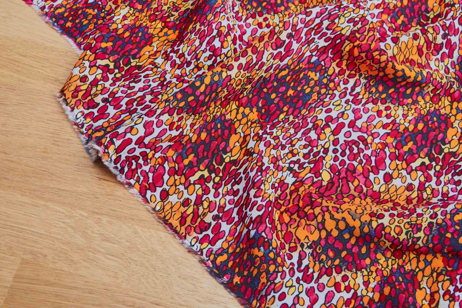 Abstract Spots & Dots Printed Soft Viscose - Pinks, Orange, Yellow and Black on Pale Blue fabric, image 5 of 6