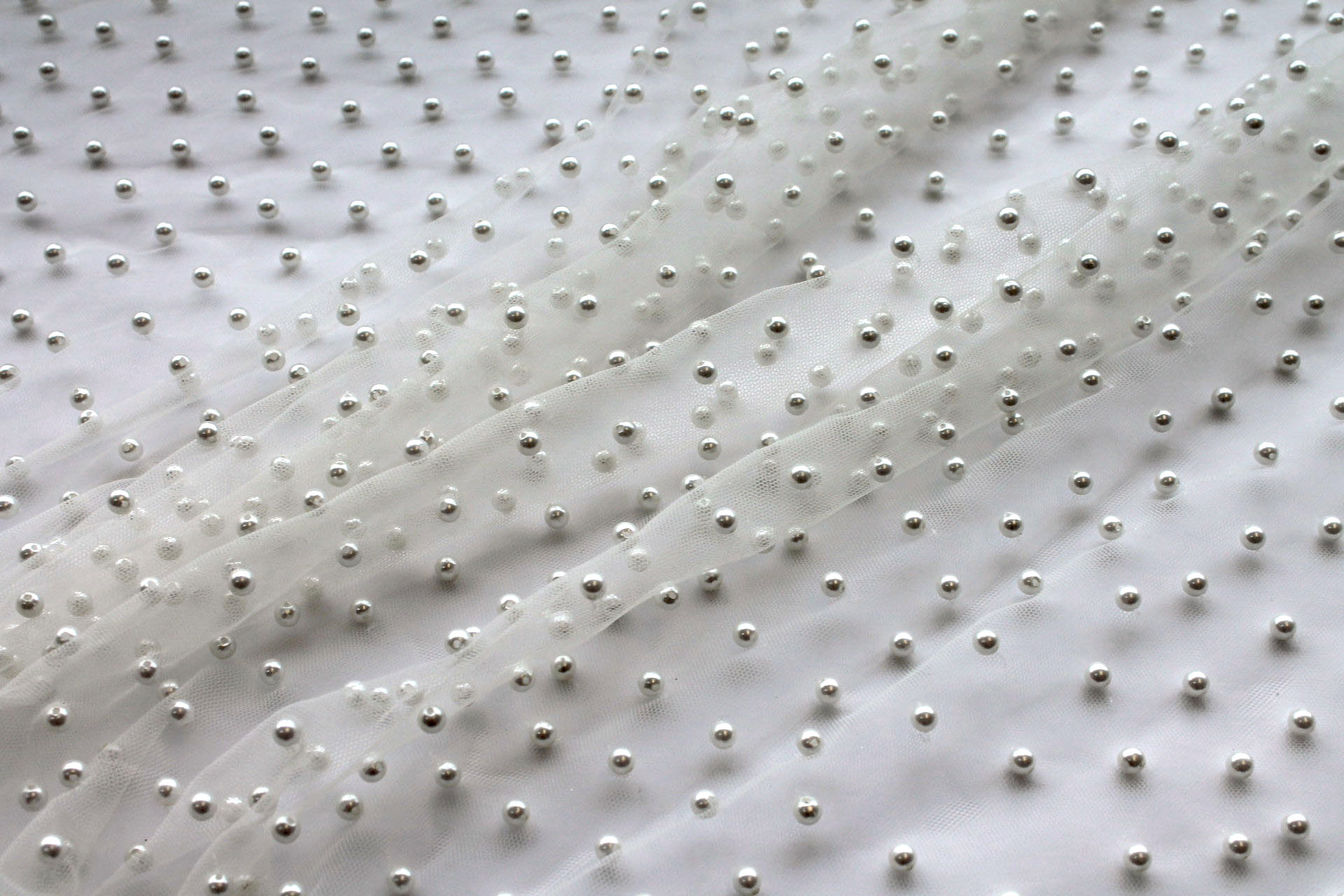 Medium Ivory Pearls on Ivory Nylon Tulle fabric