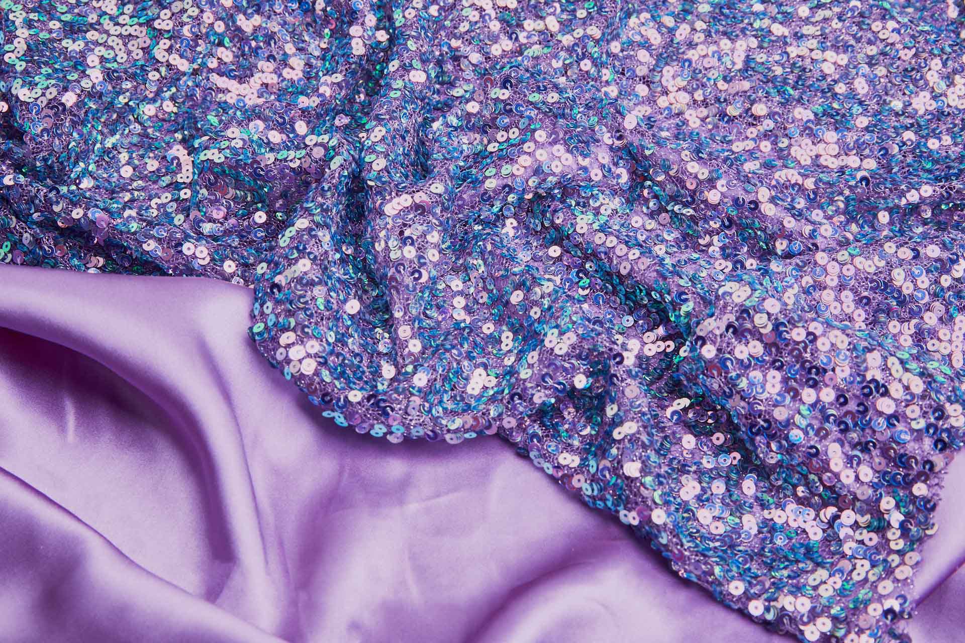 Iridescent Purple / Green Mermaid Holo Sequin on Purple Mesh fabric