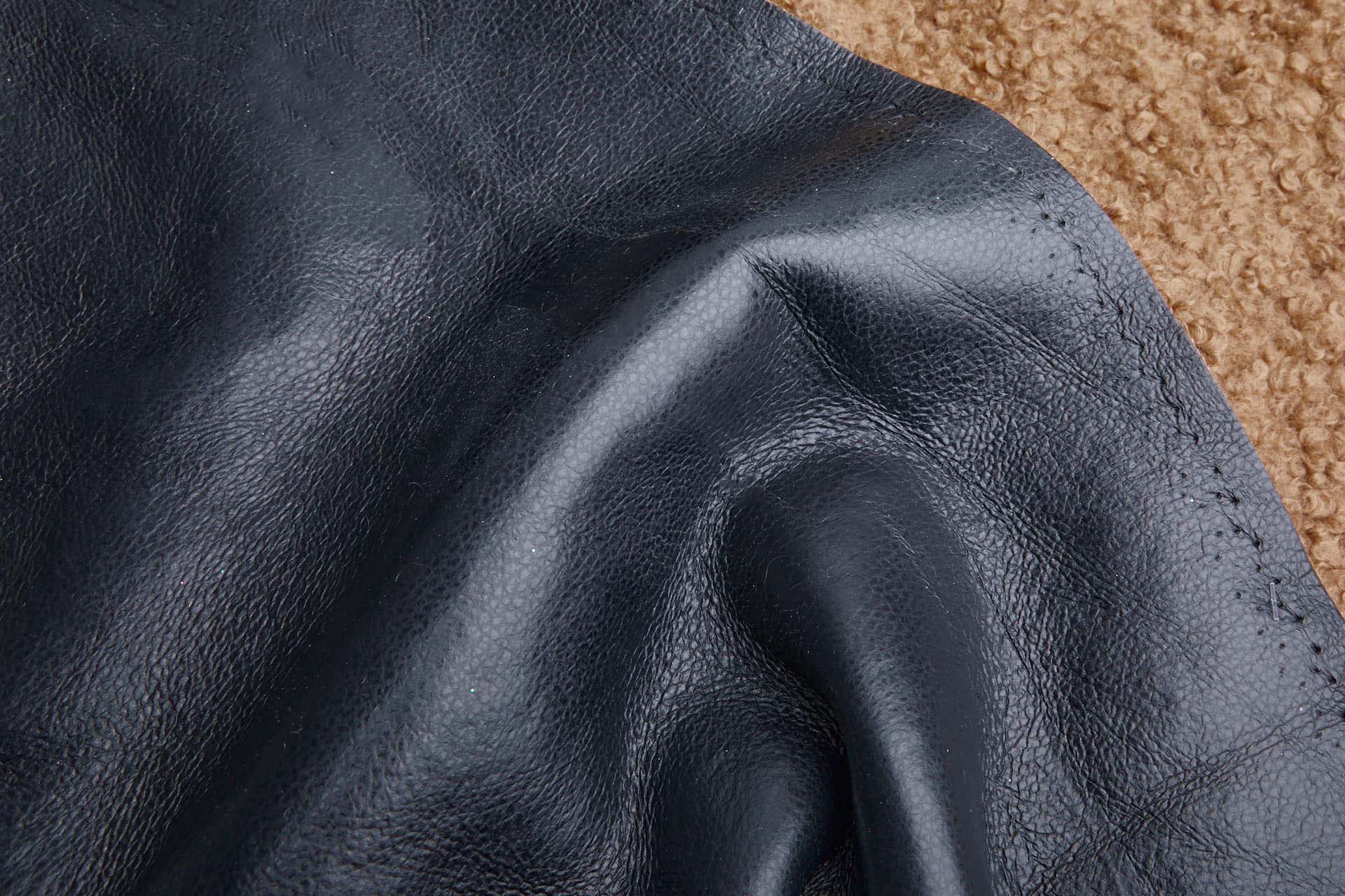 Shearling Faux Fur Backed Leatherette - Camel on Black fabric, image 4 of 7
