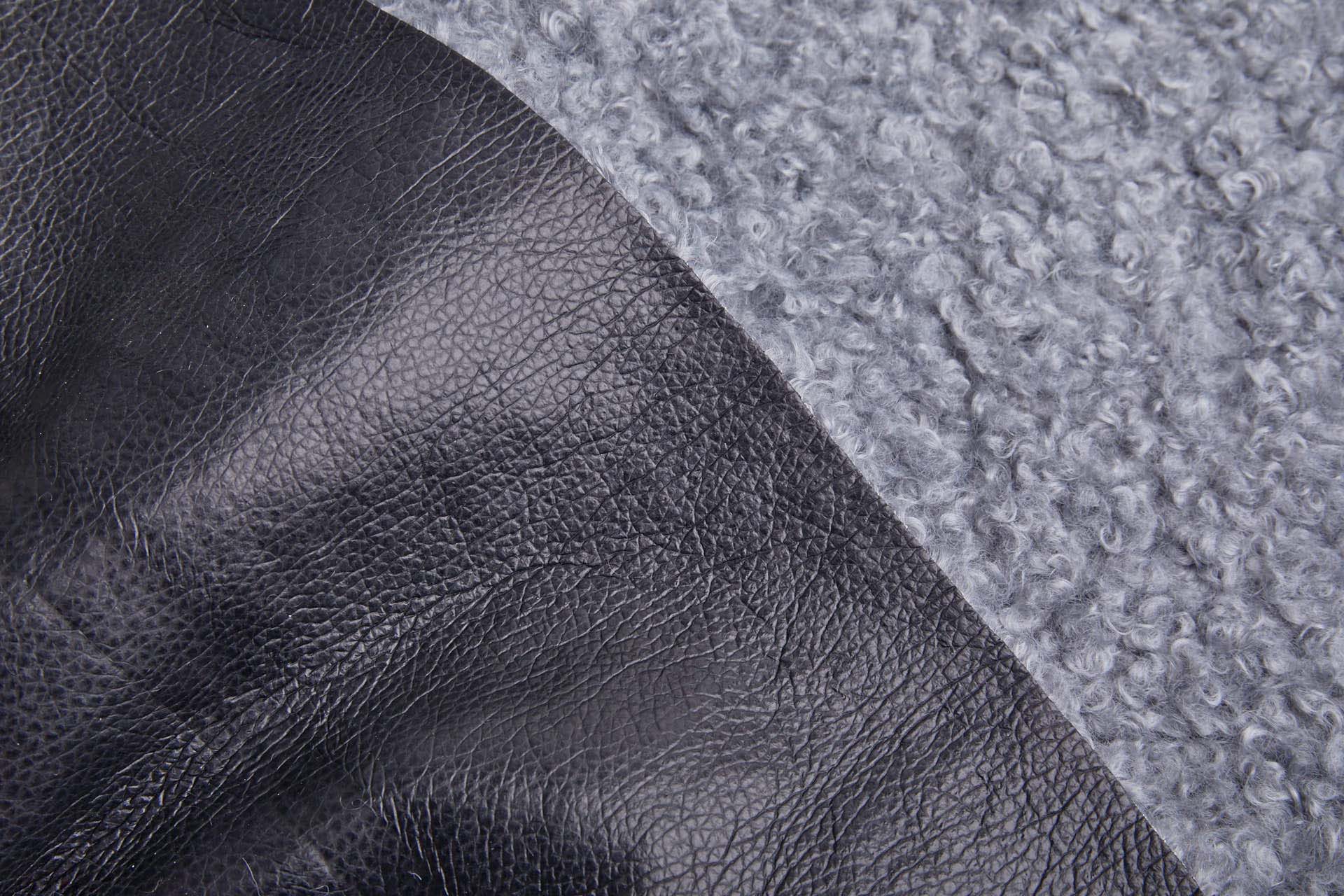 Shearling Faux Fur Backed Leatherette - Steel Grey on Black fabric