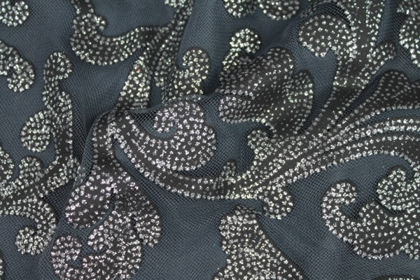 Photographed on a grey background fabric.