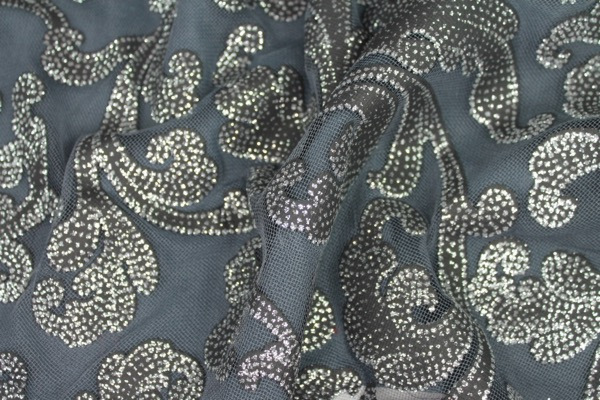 Photographed on a grey background fabric.