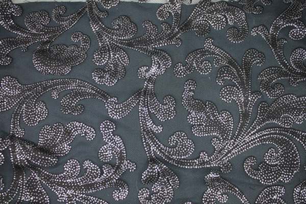 Photographed on a grey background fabric.