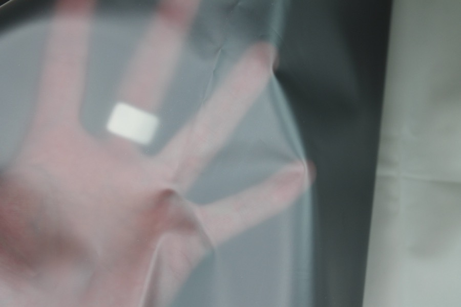 Photographed on a textured grey background for visibility.