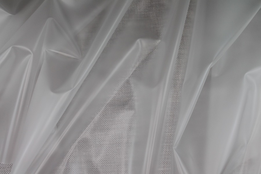 Photographed on a textured grey background for visibility.