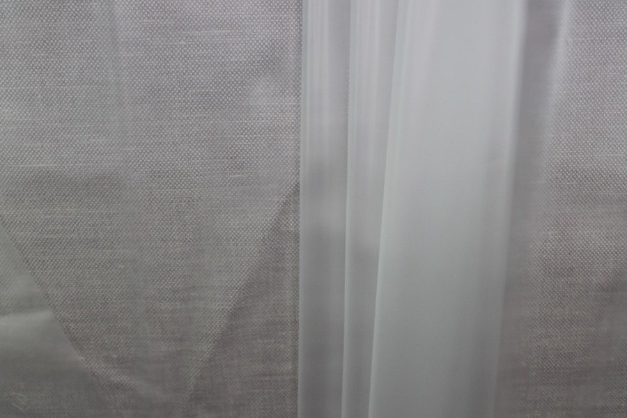 Photographed on a textured grey background for visibility.