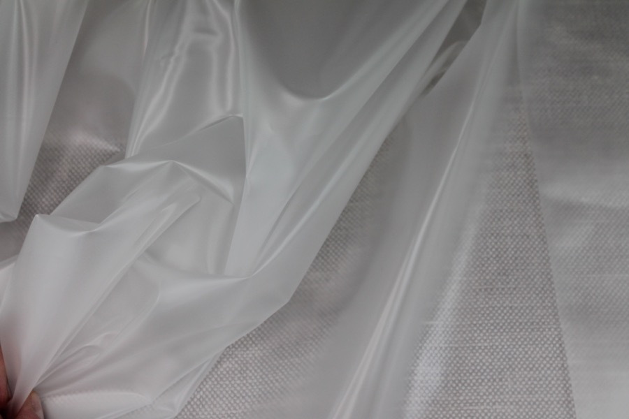 Photographed on a textured grey background for visibility.