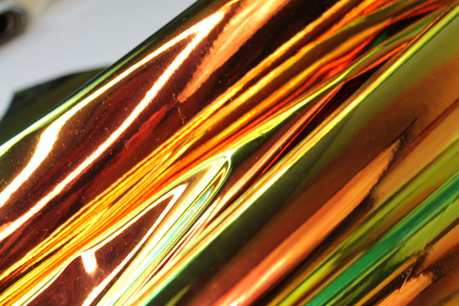 BACK IN STOCK - Iridescent Mirror PVC - Green/Orange on Black fabric