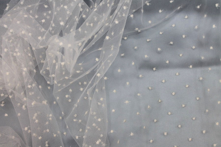 Photographed on a pale blue satin background cloth