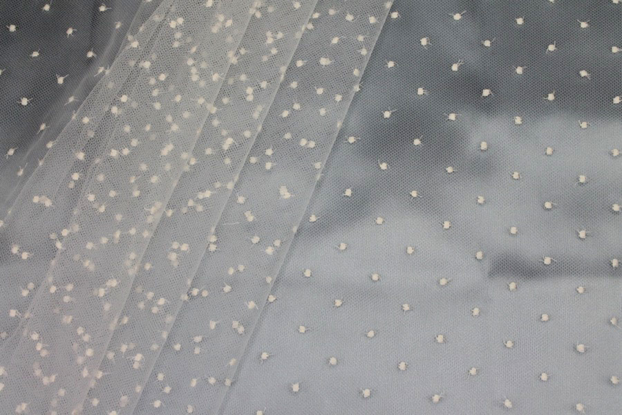 Photographed on a pale blue satin background cloth