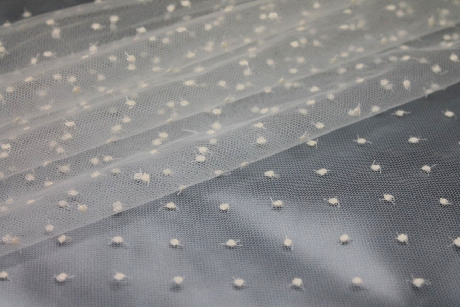 Photographed on a pale blue satin background cloth