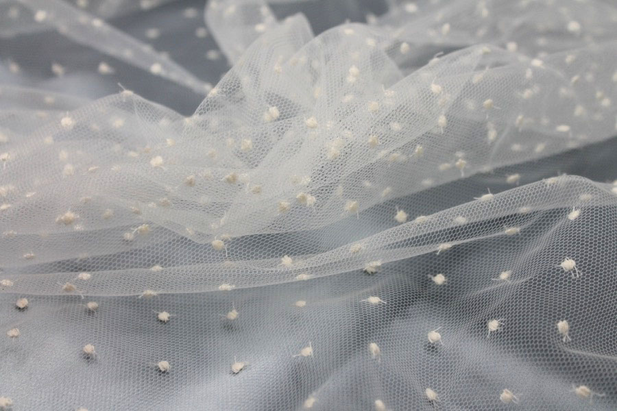Photographed on a pale blue satin background cloth