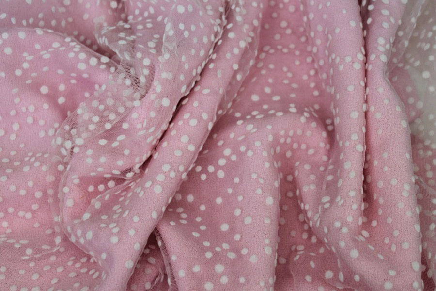 Photographed on a bubblegum pink background fabric.