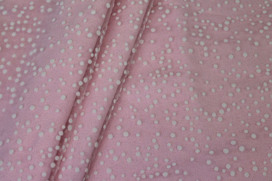 Photographed on a bubblegum pink background fabric.