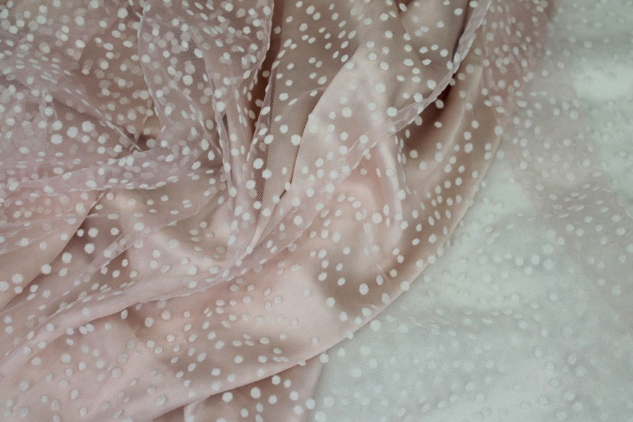 Photographed on a powder pink background fabric.