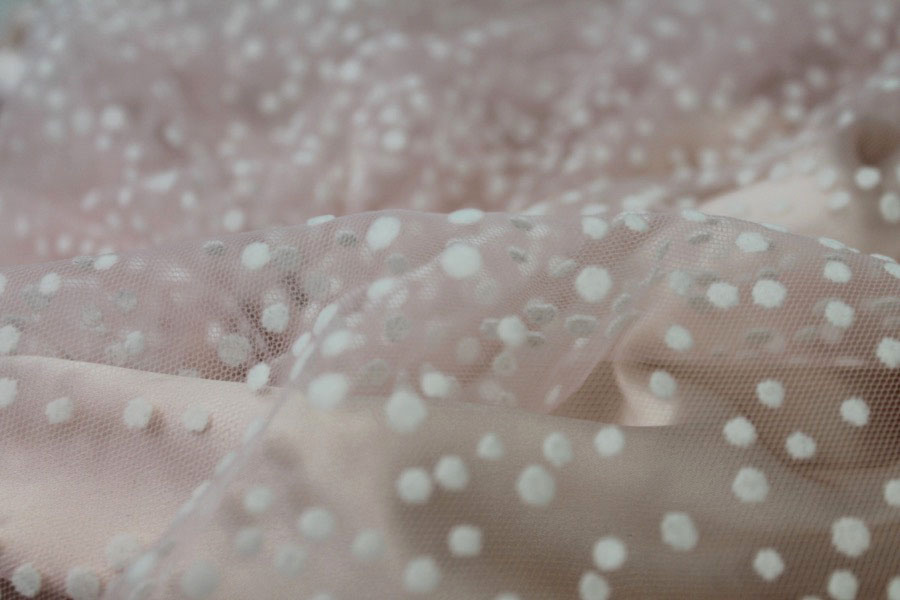 Photographed on a powder pink background fabric.