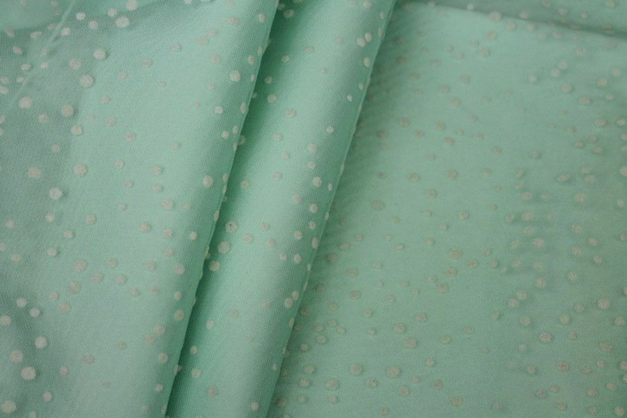 Photographed on a mint coloured background fabric