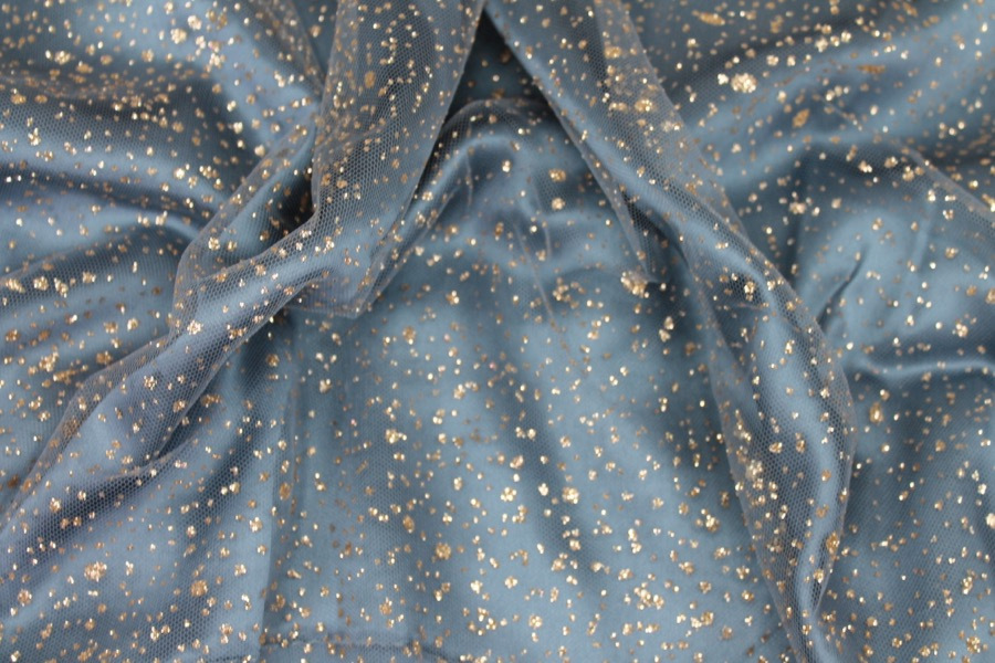 Photographed on a powder blue silk satin