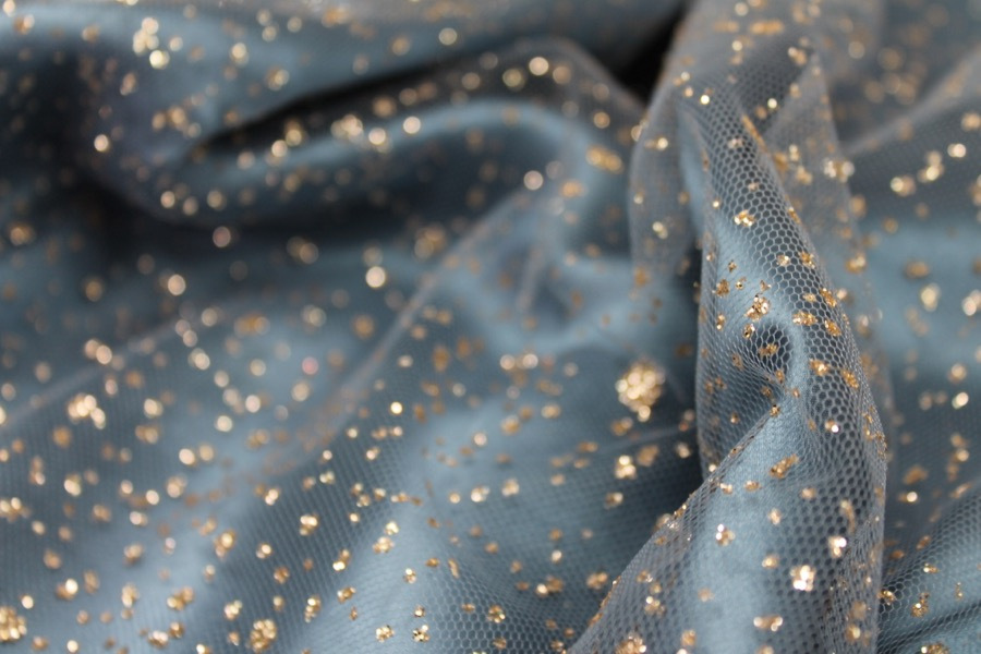 Photographed on a powder blue silk satin