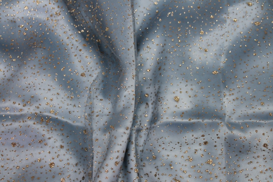 Photographed on a pale blue silk satin