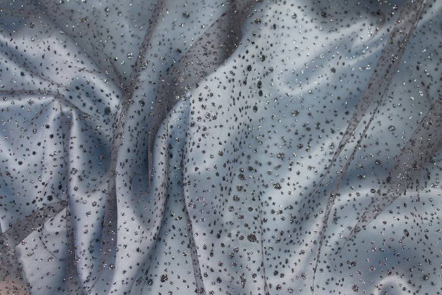 Photographed on a pale blue silk satin