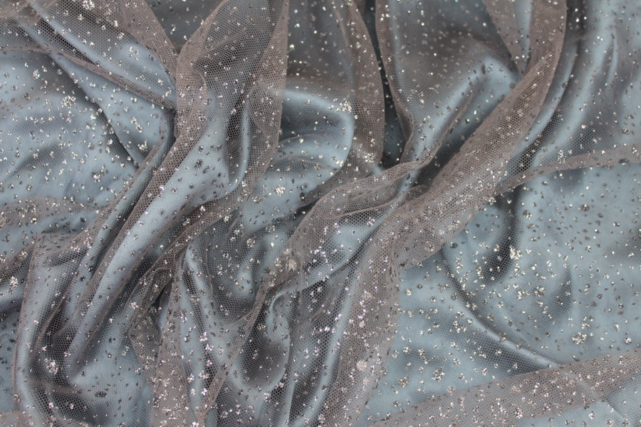 Photographed on a pale blue silk satin