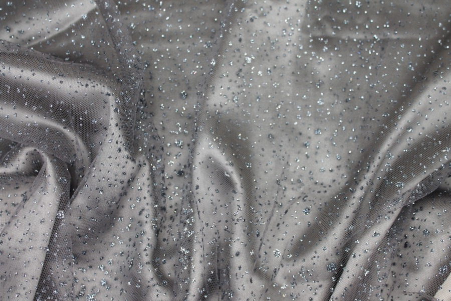 Photographed on a grey blue silk satin