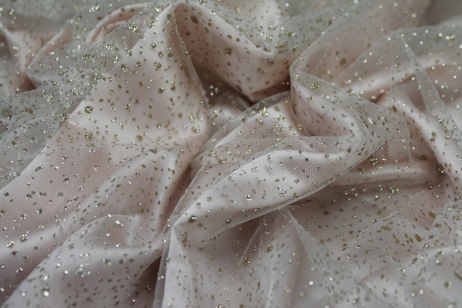Photographed on a pale pink satin fabric
