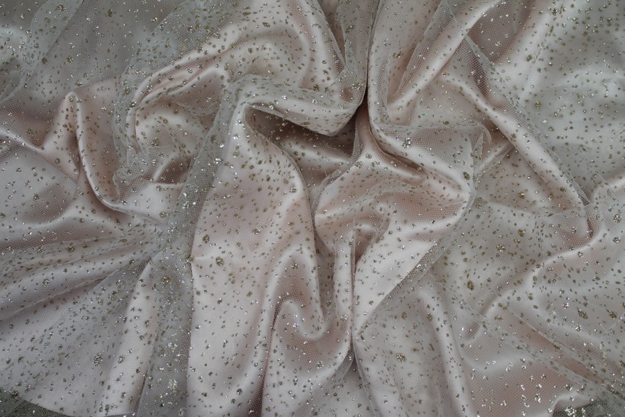 Photographed on a pale pink satin fabric