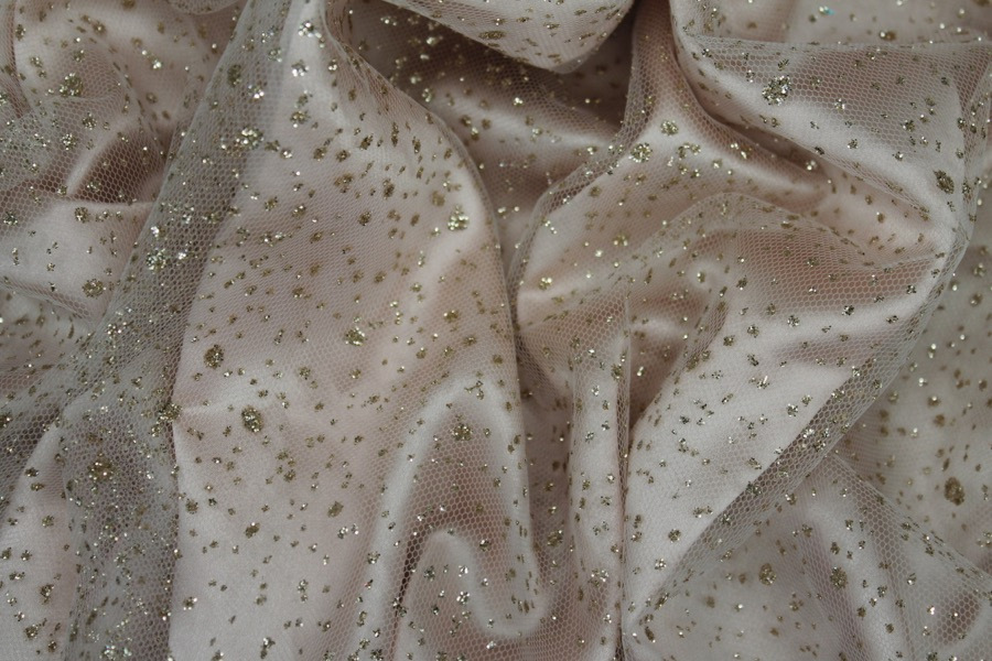 Photographed on a pale pink satin fabric