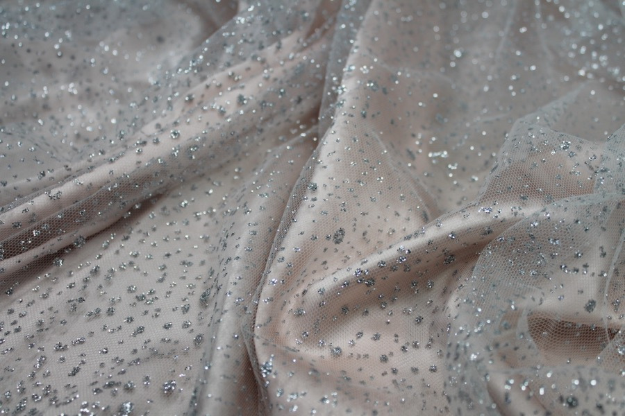 Photographed on a pale pink fabric