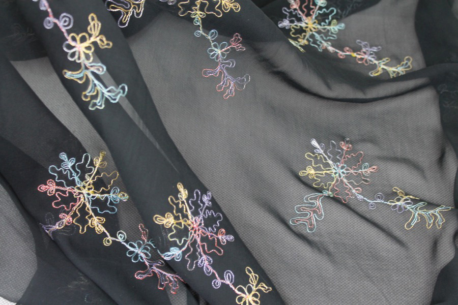 Black Silk Chiffon with Colourful Snowflake Flowers fabric