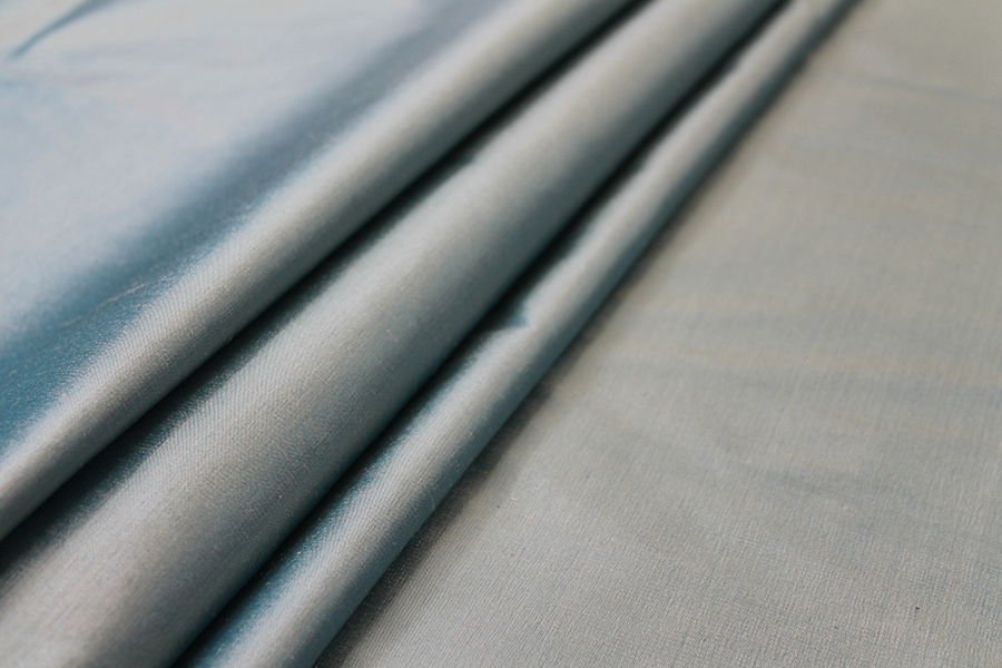 Silk Dupion - Teal shot Cream fabric
