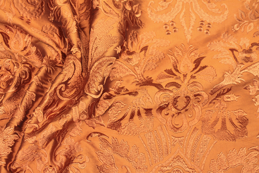 Heavy Jacquard Style Embroidery - Orange fabric
