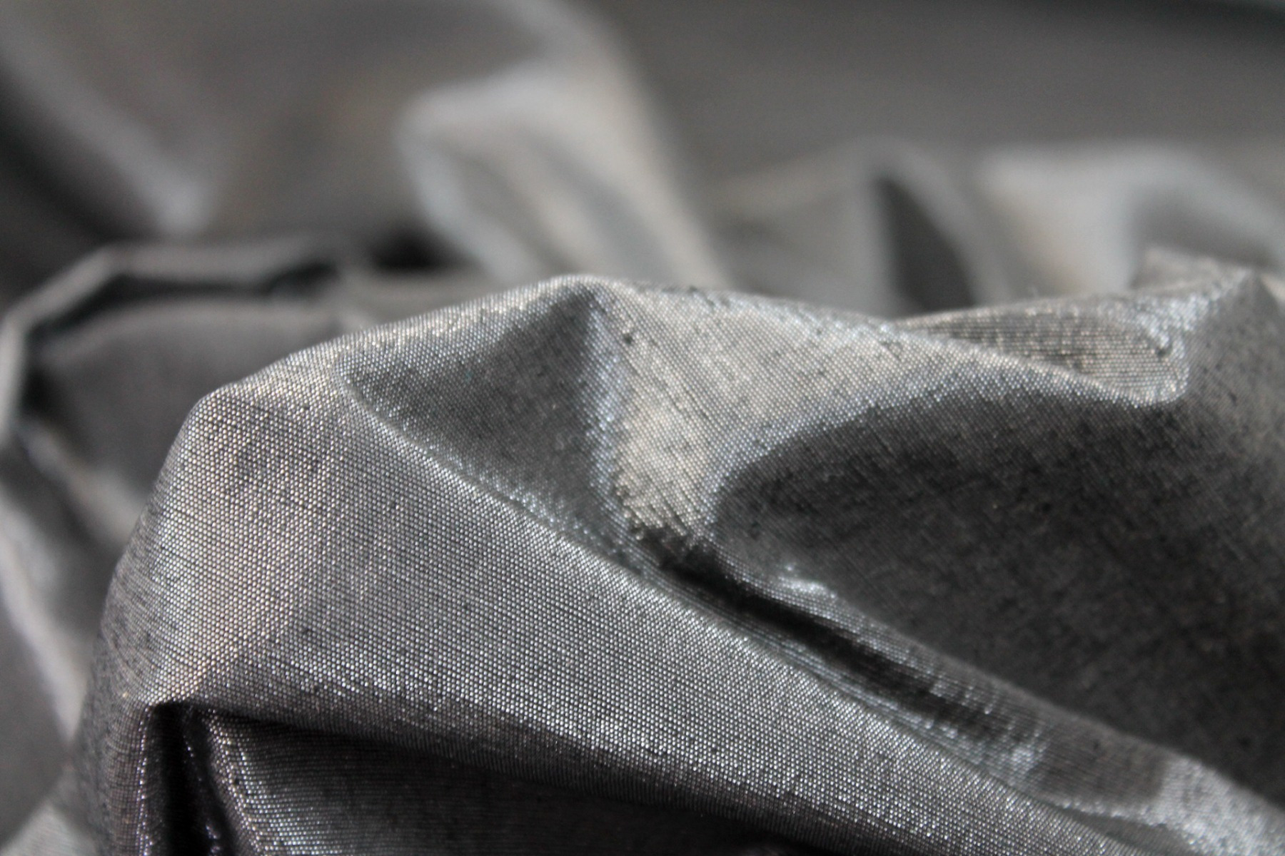 Metallic Silk Noil - Black shot Clear fabric