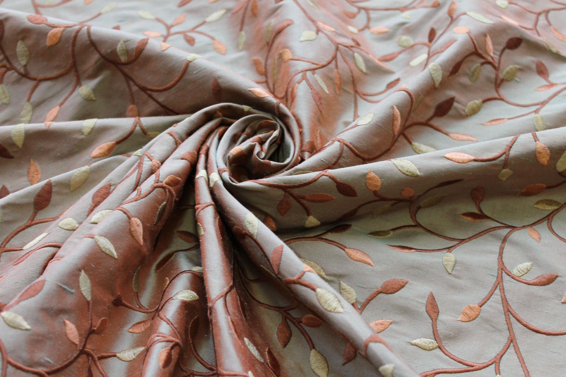 Embroidered Silk Dupion - Gold Copper and Brown Leaves and Vines On Orange shot Green fabric