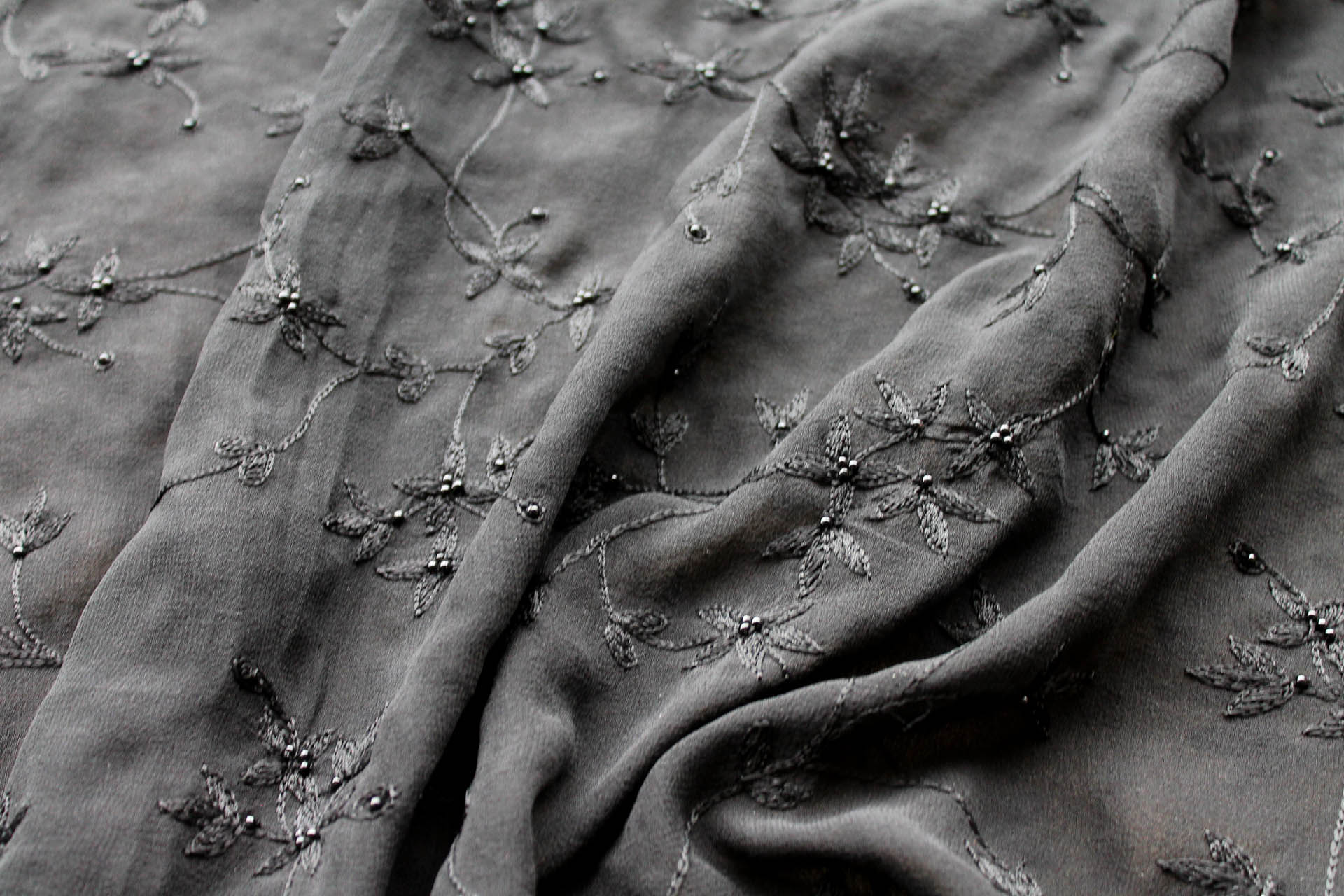 Black Floral Embroidered Silk Chiffon with Pearls fabric