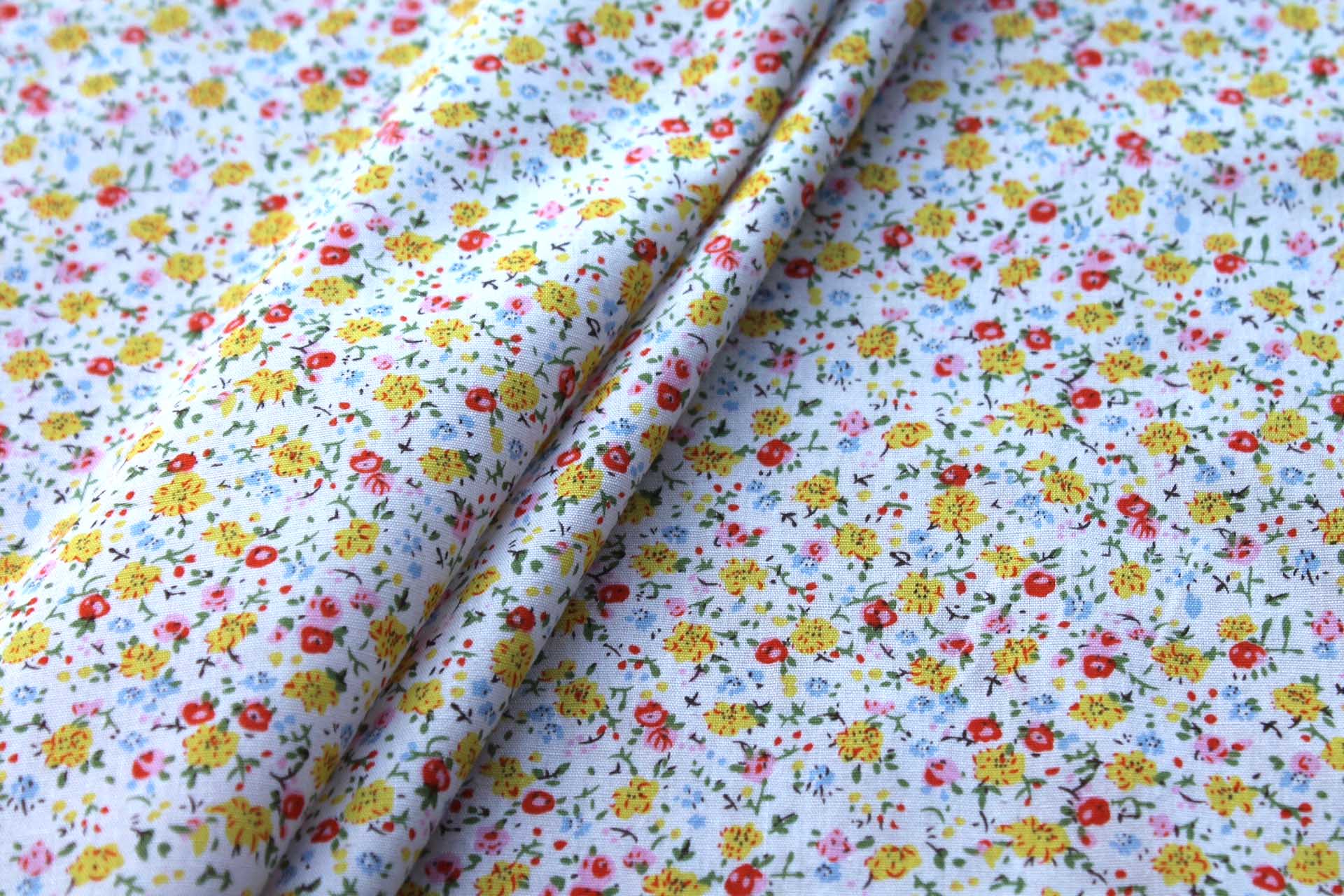 Printed Cotton Lawn - Yellow, Orange and Pale Blue on Off White fabric