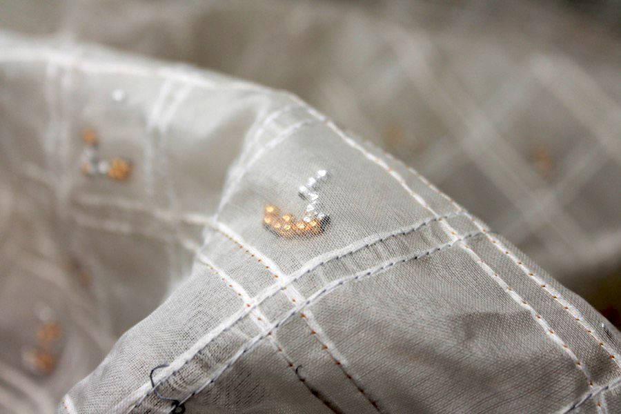 Silver and Gold Beads Sandwiched in Silk Organza - Ivory fabric
