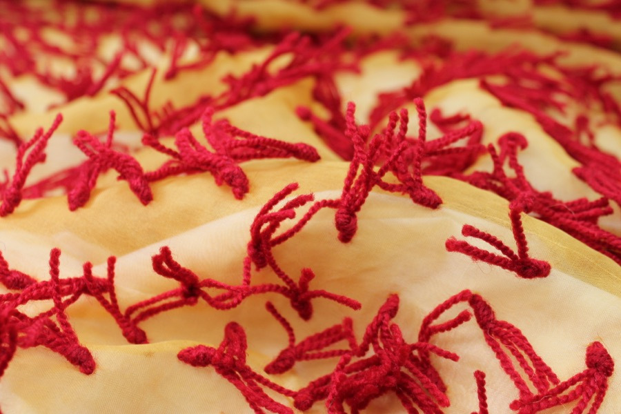 Yarn Tassels on Silk Organza - Red on Yellow fabric